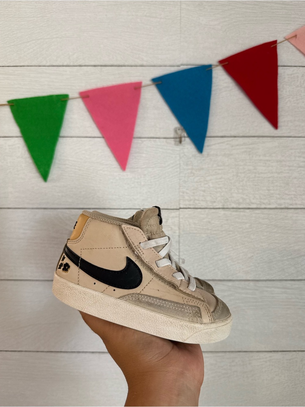 Nike Kids High-Top Sneaker in Cream with Black Swoosh